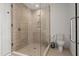 Modern shower with glass enclosure, tiled walls, and sleek fixtures in a bright bathroom at 301 Quay Commons # 1204, Sarasota, FL 34236