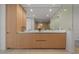 Modern bathroom showcasing double sinks with light wood cabinetry and ample lighting at 301 Quay Commons # 1610, Sarasota, FL 34236