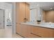 Bright bathroom featuring a light wood dual sink vanity and modern fixtures at 301 Quay Commons # 1610, Sarasota, FL 34236