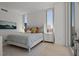 Bright bedroom featuring a comfortable bed, stylish décor, and large windows with beautiful city views at 301 Quay Commons # 1610, Sarasota, FL 34236