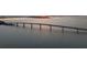 Scenic view of a long bridge stretching over the water at sunset, offering a picturesque transportation route at 301 Quay Commons # 1610, Sarasota, FL 34236