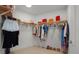 Spacious walk-in closet features custom shelving and plenty of room for storage at 301 Quay Commons # 1610, Sarasota, FL 34236