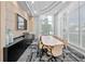 Bright conference room with large table and city views at 301 Quay Commons # 1610, Sarasota, FL 34236