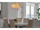 Bright dining area with a modern chandelier and seating for six offers a welcoming atmosphere at 301 Quay Commons # 1610, Sarasota, FL 34236