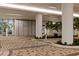 Inviting entrance with lush landscaping, modern architecture, and clear signage at 301 Quay Commons # 1610, Sarasota, FL 34236