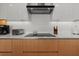 Modern kitchen with stainless steel appliances and sleek countertops, ideal for cooking enthusiasts at 301 Quay Commons # 1610, Sarasota, FL 34236