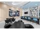 Community lounge area with stylish bar, seating, and modern art at 301 Quay Commons # 1610, Sarasota, FL 34236