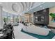 Luxurious lounge area featuring elegant seating, stylish decor, and expansive windows at 301 Quay Commons # 1610, Sarasota, FL 34236