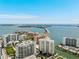 Beautiful aerial view of cityscape featuring luxury highrise residences along the Sarasota Bay and blue skies at 301 Quay Commons # 507, Sarasota, FL 34236