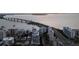 Elevated view of a bridge over a bay with buildings and roadways alongside at 301 Quay Commons # 507, Sarasota, FL 34236