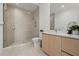 Sleek bathroom with a glass-enclosed shower and modern vanity at 301 Quay Commons # 507, Sarasota, FL 34236