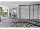 Entrance featuring a patterned brick walkway, modern architectural design and landscaping at 301 Quay Commons # 507, Sarasota, FL 34236