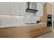 Modern kitchen features sleek cabinetry, stainless steel appliances, and elegant countertops at 301 Quay Commons # 507, Sarasota, FL 34236