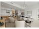 Open-concept living room featuring modern furnishings, kitchen island, and a cozy atmosphere at 301 Quay Commons # 507, Sarasota, FL 34236