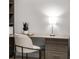 Bright office space featuring built-in desk, drawers, and ample lighting at 301 Quay Commons # 507, Sarasota, FL 34236