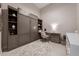 Multi-purpose room featuring built-in storage, desk, and neutral finishes at 301 Quay Commons # 507, Sarasota, FL 34236