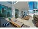 Spacious outdoor patio area with sleek furniture, city views, and plenty of sunlight at 301 Quay Commons # 507, Sarasota, FL 34236