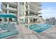 Relaxing condominium pool and outdoor seating area, perfect for sunny days at 301 Quay Commons # 507, Sarasota, FL 34236