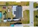 Aerial view of property with a dark roof and an expansive backyard, offering great outdoor living potential at 309 Glen Oak Rd, Venice, FL 34293