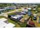 Aerial view of the house showing fenced in backyard, small patio, and RV parked on property at 309 Glen Oak Rd, Venice, FL 34293