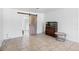 This room features a barn door, tile flooring, and an aquarium at 309 Glen Oak Rd, Venice, FL 34293