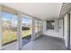 Enclosed porch featuring walls of windows and access to the backyard at 309 Glen Oak Rd, Venice, FL 34293