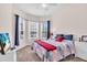 A bedroom featuring large windows and a TV set at 3514 92Nd E Ave, Parrish, FL 34219