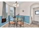 Cozy dining area with glass-top table, metal chairs, tile floors, and natural light at 3514 92Nd E Ave, Parrish, FL 34219