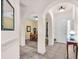 Bright foyer featuring tiled floors and arched doorways leading to other rooms at 3514 92Nd E Ave, Parrish, FL 34219