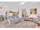 Inviting living area with neutral tones, flowing into the dining and kitchen spaces at 3514 92Nd E Ave, Parrish, FL 34219