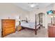 Cozy bedroom featuring a canopy bed, carpeted floors, dresser and ensuite bathroom at 3514 92Nd E Ave, Parrish, FL 34219