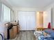 Bedroom with laminate floors, closet and doorway at 3606 Beneva Rd # 506, Sarasota, FL 34232