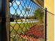 Fenced backyard with manicured landscaping, offering privacy and outdoor enjoyment at 389 Millport Nw St, Port Charlotte, FL 33948