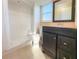 Bright bathroom featuring a sleek vanity, toilet, and walk-in shower for a modern, clean design at 389 Millport Nw St, Port Charlotte, FL 33948