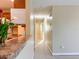 Hallway between the kitchen and bedrooms with tile floors at 389 Millport Nw St, Port Charlotte, FL 33948