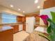 Bright kitchen with modern appliances, granite countertops, and white cabinets at 389 Millport Nw St, Port Charlotte, FL 33948