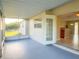 Covered patio area with view to the interior living spaces at 389 Millport Nw St, Port Charlotte, FL 33948