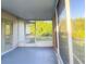 View of the screen porch area and door to the yard at 389 Millport Nw St, Port Charlotte, FL 33948