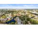 Aerial view of community with mature trees, landscaping, lakes, and winding waterways at 4325 46Th W Ave # 104, Bradenton, FL 34210