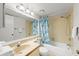 Bright bathroom featuring a shower-tub combination with tiled walls and modern fixtures at 4325 46Th W Ave # 104, Bradenton, FL 34210