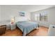 Bright bedroom with wood flooring, and large windows at 4325 46Th W Ave # 104, Bradenton, FL 34210