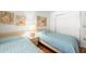 Comfortable bedroom featuring two twin beds, stylish decor, and a spacious closet at 4325 46Th W Ave # 104, Bradenton, FL 34210