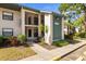 Inviting two-story condo with a well-maintained lawn and landscaped entrance at 4325 46Th W Ave # 104, Bradenton, FL 34210