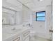 Bathroom featuring tub, vanity and storage at 4487 Glebe Farm Rd, Sarasota, FL 34235