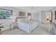Bright bedroom with a large window, neutral colors, and double door closet at 4487 Glebe Farm Rd, Sarasota, FL 34235