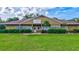 Charming single-story building featuring well-manicured landscaping and an inviting entrance at 4487 Glebe Farm Rd, Sarasota, FL 34235