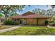 Charming commercial building with a well-maintained lawn and mature trees, featuring signage for Magic Massage & Spa at 4487 Glebe Farm Rd, Sarasota, FL 34235