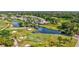 Overhead shot of a scenic golf course with palm trees and water features at 4487 Glebe Farm Rd, Sarasota, FL 34235