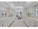 Eat-in kitchen features white cabinets and appliances with views into breakfast nook at 4487 Glebe Farm Rd, Sarasota, FL 34235