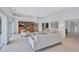 Spacious living room with built-in display, plush seating, modern furniture, and high ceilings at 4487 Glebe Farm Rd, Sarasota, FL 34235